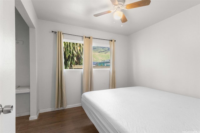 84-541 Nukea St, Waianae, HI 96792 - bedroom with baseboards, a ceiling fan, and dark wood-type flooring