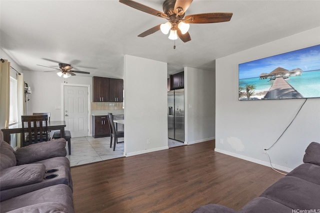 84-541 Nukea St, Waianae, HI 96792 - living area featuring light wood-style flooring, baseboards, and ceiling fan