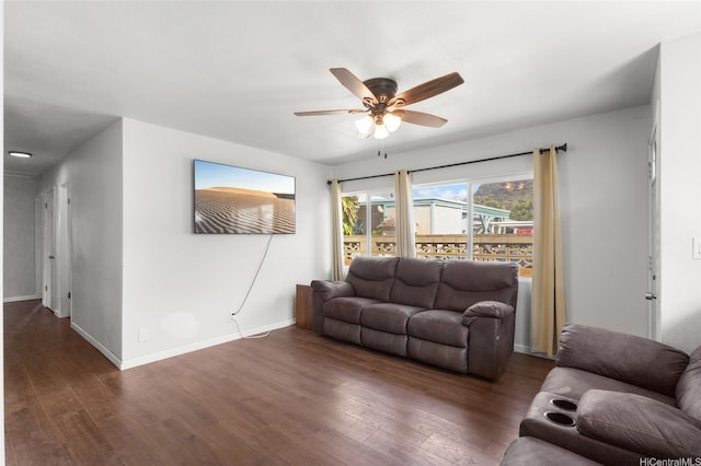 84-541 Nukea St, Waianae, HI 96792 - living area featuring baseboards, a ceiling fan, and dark wood finished floors