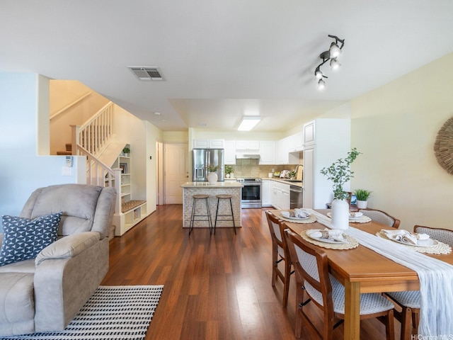 91-2067 Kaioli St Unit 503, Ewa Beach, HI 96706 - dining area with stairway and dark wood-style floors