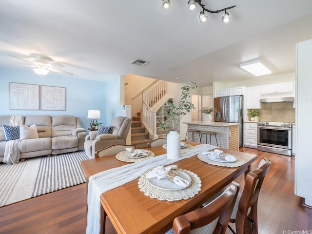 91-2067 Kaioli St Unit 503, Ewa Beach, HI 96706 - dining space with stairs, wood finished floors, and ceiling fan