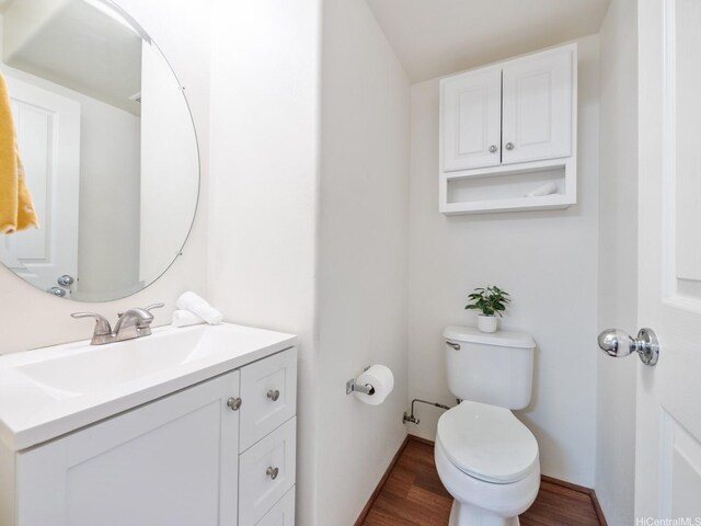91-2067 Kaioli St Unit 503, Ewa Beach, HI 96706 - half bath featuring wood finished floors, toilet, vanity, and baseboards
