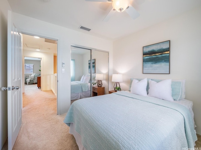 91-2067 Kaioli St Unit 503, Ewa Beach, HI 96706 - bedroom with light colored carpet, a closet, attic access, and ceiling fan