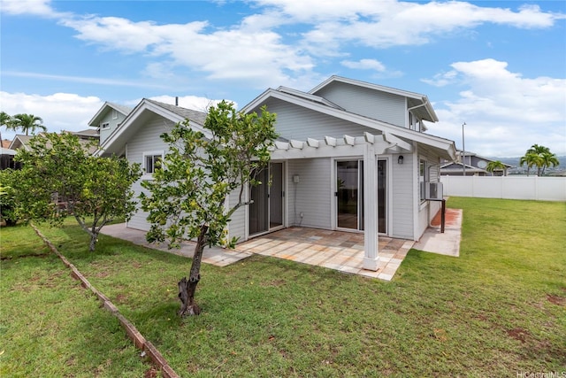 rear view of house featuring a pergola and a patio