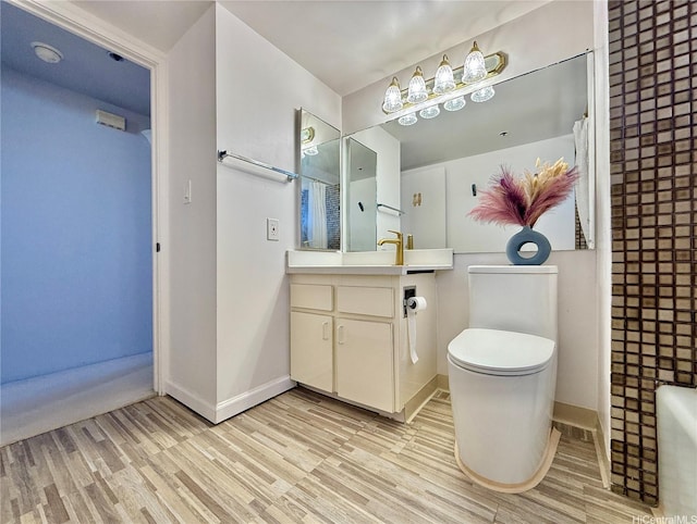990 Ala Nanala St Unit 19A, Honolulu, HI 96818 - bathroom featuring wood finished floors, baseboards, and toilet