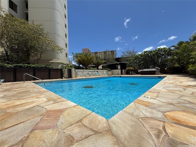 990 Ala Nanala St Unit 19A, Honolulu, HI 96818 - view of swimming pool featuring a patio area and an outdoor hot tub