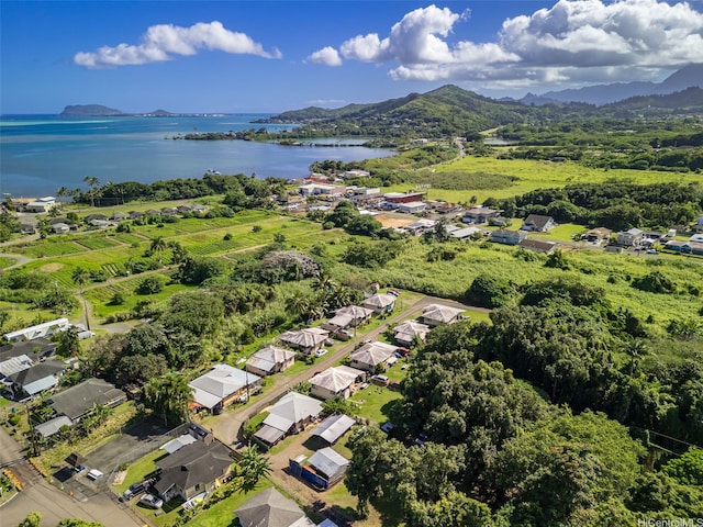 aerial view with a water and mountain view and a residential view