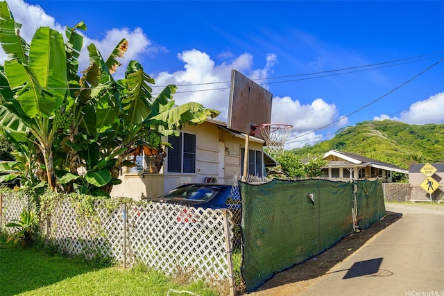 view of side of home with fence
