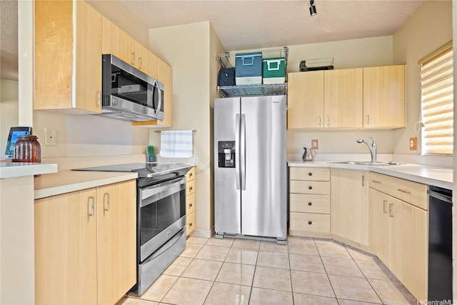 91-1012 Laaulu St Unit 28A, Ewa Beach, HI 96706 - kitchen featuring appliances with stainless steel finishes, light brown cabinets, light countertops, and light tile patterned floors