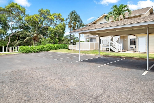 91-1012 Laaulu St Unit 28A, Ewa Beach, HI 96706 - partially covered parking lot featuring stairway