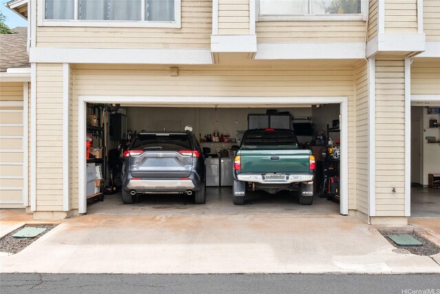 91-1012 Laaulu St Unit 28A, Ewa Beach, HI 96706 - garage featuring driveway