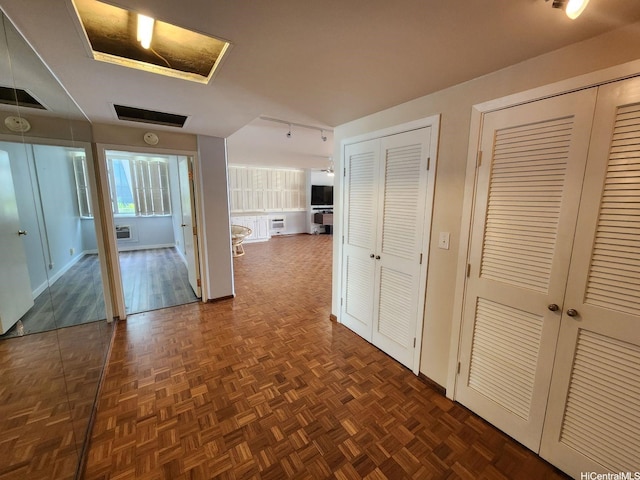 2500 Kalakaua Ave Unit 201, Honolulu, HI 96815 - hallway featuring baseboards, visible vents, and an AC wall unit