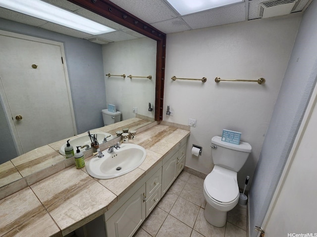 2500 Kalakaua Ave Unit 201, Honolulu, HI 96815 - bathroom with toilet, vanity, tile patterned flooring, a drop ceiling, and baseboards
