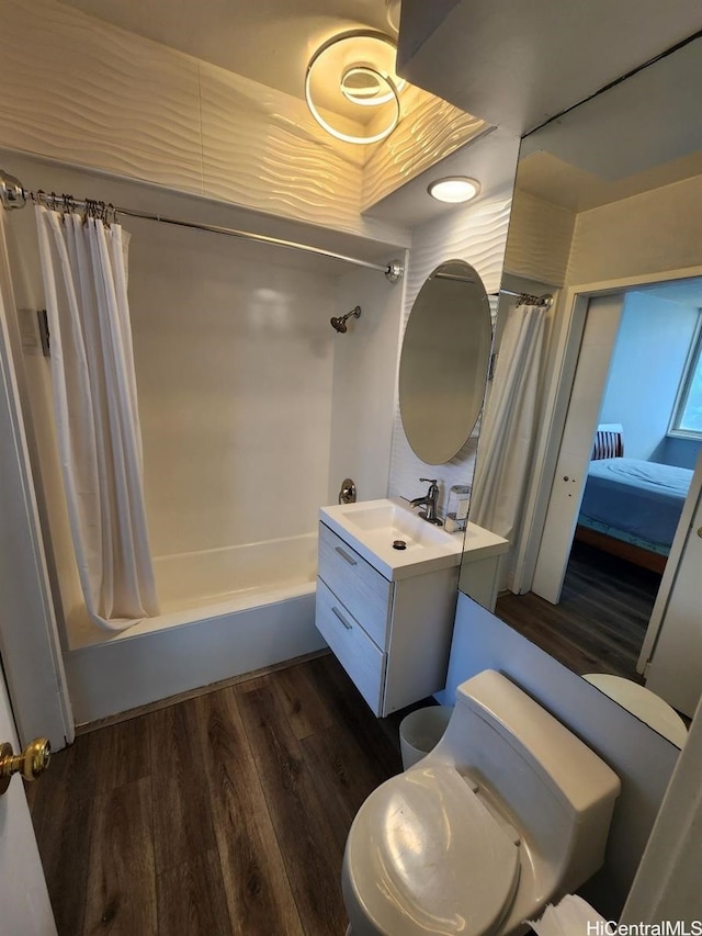2500 Kalakaua Ave Unit 201, Honolulu, HI 96815 - full bathroom featuring shower / bathtub combination with curtain, wood finished floors, vanity, and toilet