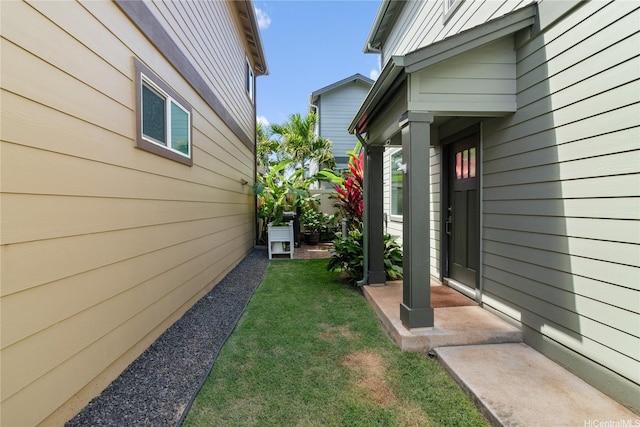 view of home's exterior with a yard