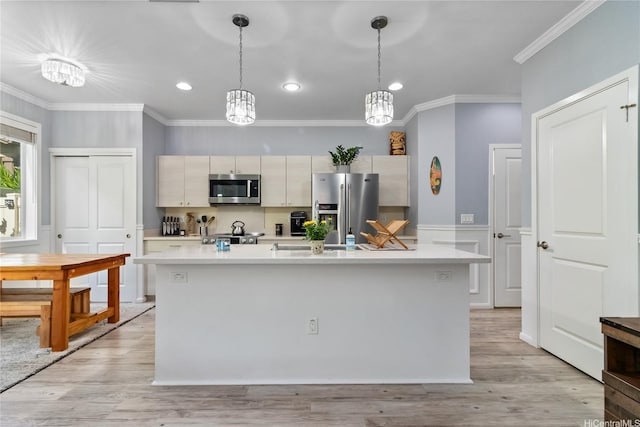kitchen featuring recessed lighting, light countertops, appliances with stainless steel finishes, and crown molding