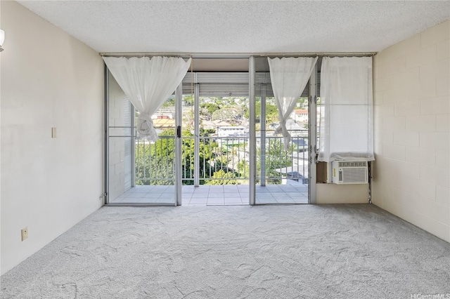 1687 Pensacola St Unit 804, Honolulu, HI 96822 - carpeted empty room with cooling unit, plenty of natural light, and a textured ceiling