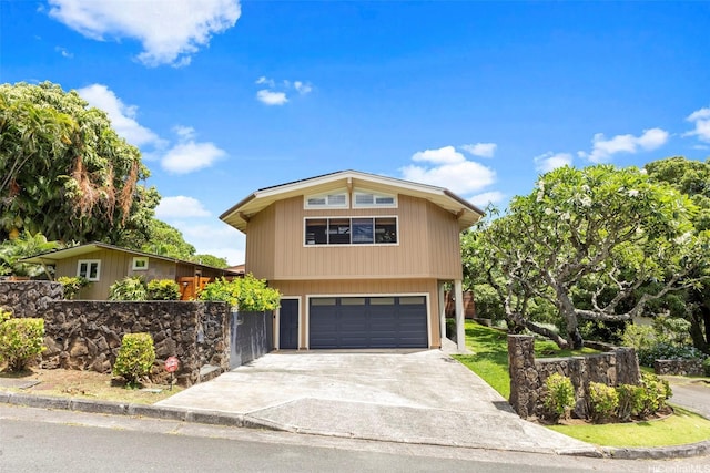 2055 Alihilani Pl, Honolulu, HI 96822 - view of front of house featuring an attached garage and concrete driveway