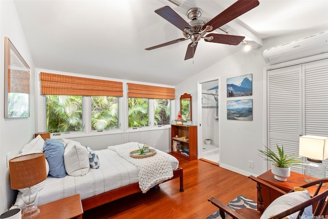 2055 Alihilani Pl, Honolulu, HI 96822 - bedroom featuring an AC wall unit, wood finished floors, ensuite bathroom, a closet, and a ceiling fan
