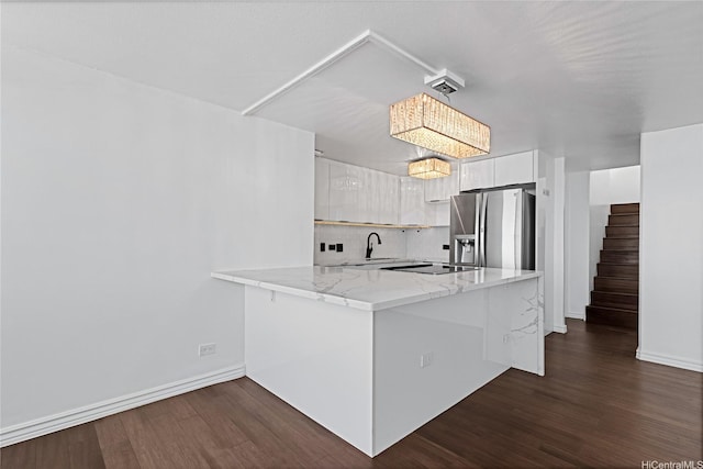98-288 Kaonohi St Unit 4401, Aiea, HI 96701 - kitchen featuring stainless steel fridge with ice dispenser, a peninsula, white cabinetry, dark wood-style flooring, and modern cabinets