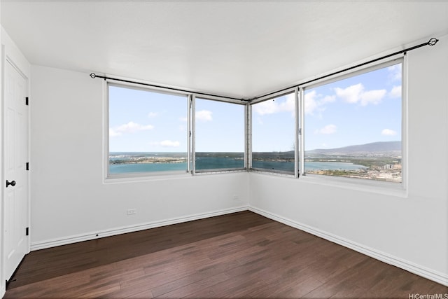 98-288 Kaonohi St Unit 4401, Aiea, HI 96701 - spare room with dark wood finished floors and a water view