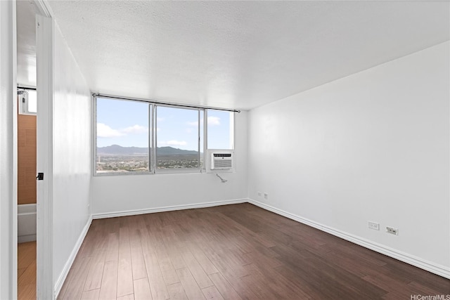 98-288 Kaonohi St Unit 4401, Aiea, HI 96701 - empty room with dark wood-type flooring, a mountain view, and cooling unit