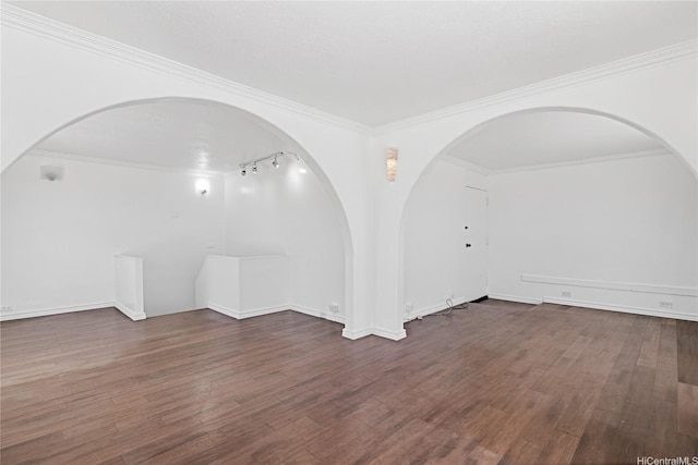 98-288 Kaonohi St Unit 4401, Aiea, HI 96701 - empty room with arched walkways, wood finished floors, crown molding, and rail lighting