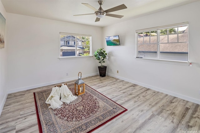 92-6127 Puapake St, Kapolei, HI 96707 - living area with a ceiling fan, wood finished floors, and baseboards
