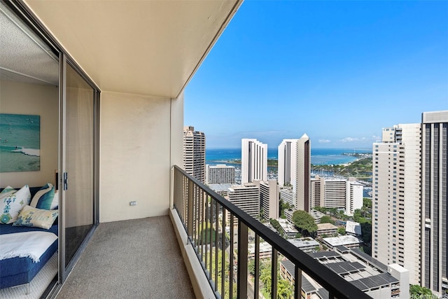 balcony featuring a water view and a view of city