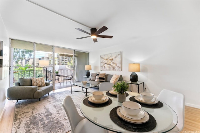 95-2031 Waikalani Pl Unit D306, Mililani, HI 96789 - dining area featuring wood finished floors, a ceiling fan, and expansive windows