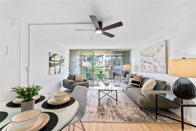 95-2031 Waikalani Pl Unit D306, Mililani, HI 96789 - living area with ceiling fan, wood finished floors, and a wall of windows