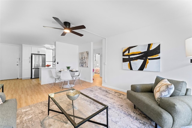 95-2031 Waikalani Pl Unit D306, Mililani, HI 96789 - living room with a ceiling fan and light wood-style flooring