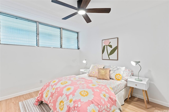 95-2031 Waikalani Pl Unit D306, Mililani, HI 96789 - bedroom with wood finished floors, baseboards, and a ceiling fan