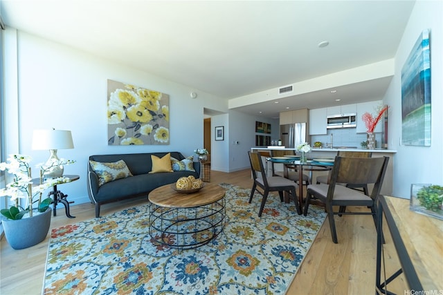 living area featuring light wood finished floors