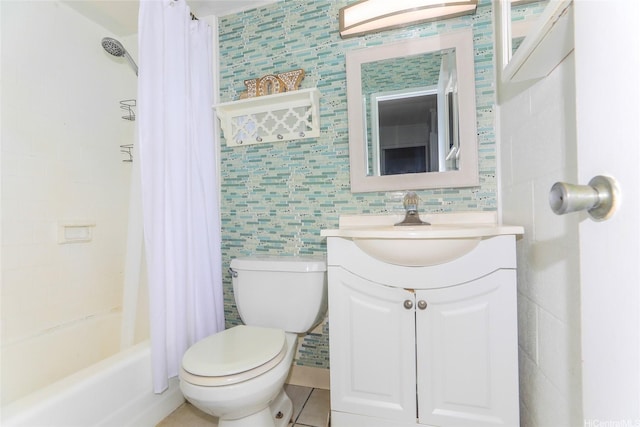 full bathroom featuring toilet, tile walls, vanity, and shower / tub combo