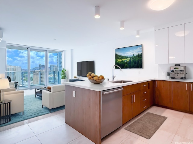 629 Keeaumoku St Unit 2205, Honolulu, HI 96814 - kitchen with a sink, a peninsula, dishwasher, open floor plan, and light countertops
