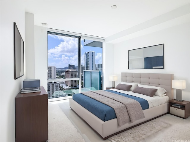 629 Keeaumoku St Unit 2205, Honolulu, HI 96814 - carpeted bedroom featuring a city view, multiple windows, and a wall of windows