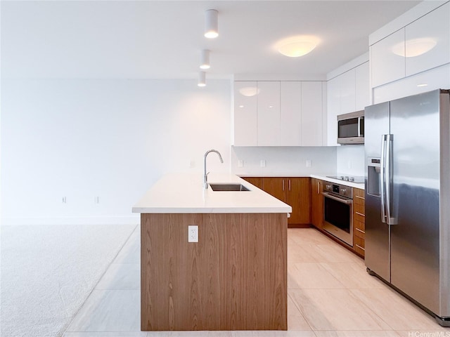 629 Keeaumoku St Unit 2205, Honolulu, HI 96814 - kitchen with modern cabinets, a sink, white cabinetry, a peninsula, and stainless steel appliances