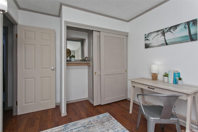 office area with crown molding, baseboards, and wood finished floors
