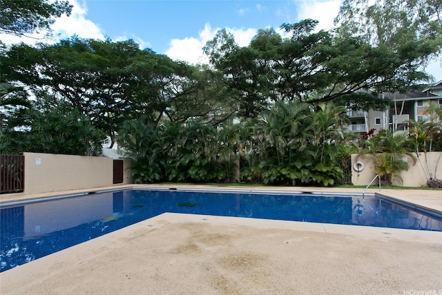 view of swimming pool with fence, a patio, and a fenced in pool