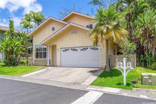 95-1007 Wikao St Unit 29, Mililani, HI 96789 - view of front facade with fence, an attached garage, a front lawn, and driveway