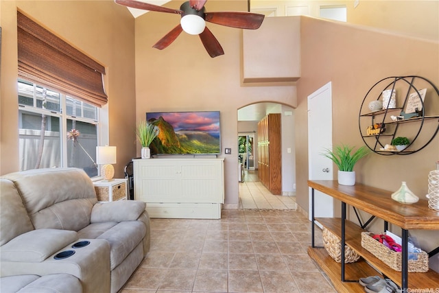 95-1007 Wikao St Unit 29, Mililani, HI 96789 - living area with ceiling fan, light tile patterned floors, a towering ceiling, and arched walkways
