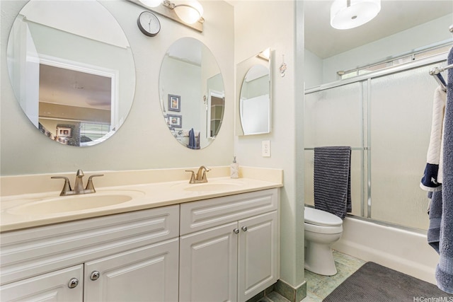 95-1007 Wikao St Unit 29, Mililani, HI 96789 - full bath featuring double vanity, toilet, bath / shower combo with glass door, and a sink