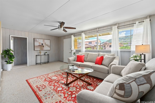 45-313 Nakuluai St, Kaneohe, HI 96744 - carpeted living area featuring a ceiling fan and wooden walls