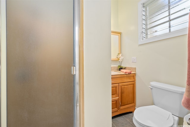 45-313 Nakuluai St, Kaneohe, HI 96744 - bathroom featuring a stall shower, toilet, vanity, and tile patterned floors