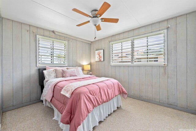 45-313 Nakuluai St, Kaneohe, HI 96744 - carpeted bedroom with multiple windows, a ceiling fan, and wood walls