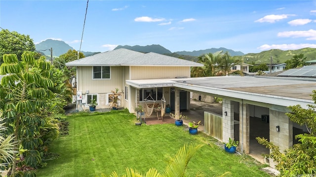 625 Maluniu Ave, Kailua, HI 96734 - rear view of house featuring a mountain view, a yard, a patio area, and a carport
