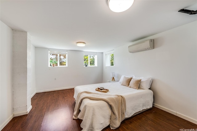 625 Maluniu Ave, Kailua, HI 96734 - bedroom with a wall mounted AC, wood finished floors, and baseboards