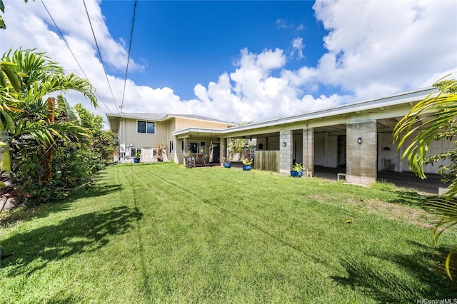 625 Maluniu Ave, Kailua, HI 96734 - rear view of house with a lawn