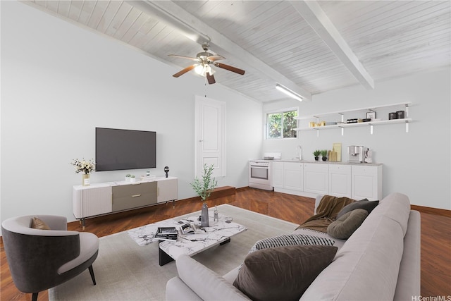 living room featuring wood finished floors, beamed ceiling, ceiling fan, wet bar, and wooden ceiling